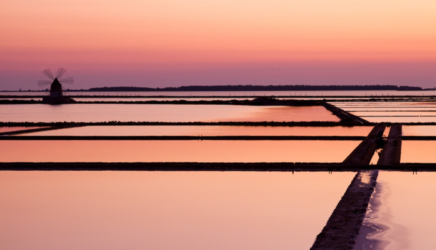 The Salt Pans of Trapani, where time is reflected in the water.